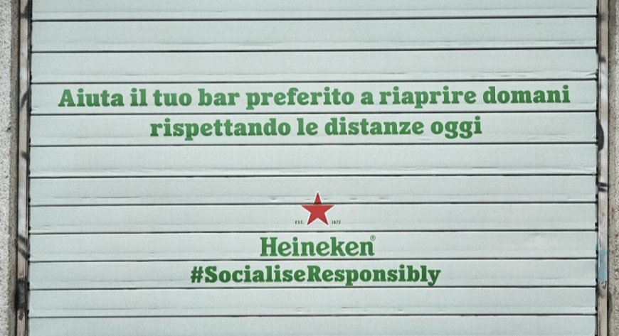 Il messaggio di Heineken Italia colora le saracinesche dei locali di Milano